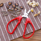 Red peanut shelling pliers with metal jaws and spring pivot