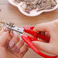 Nut shelling pliers with red grips and silver metal jaws