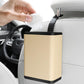 Beige hanging car seatback dustbin with black trim, open top