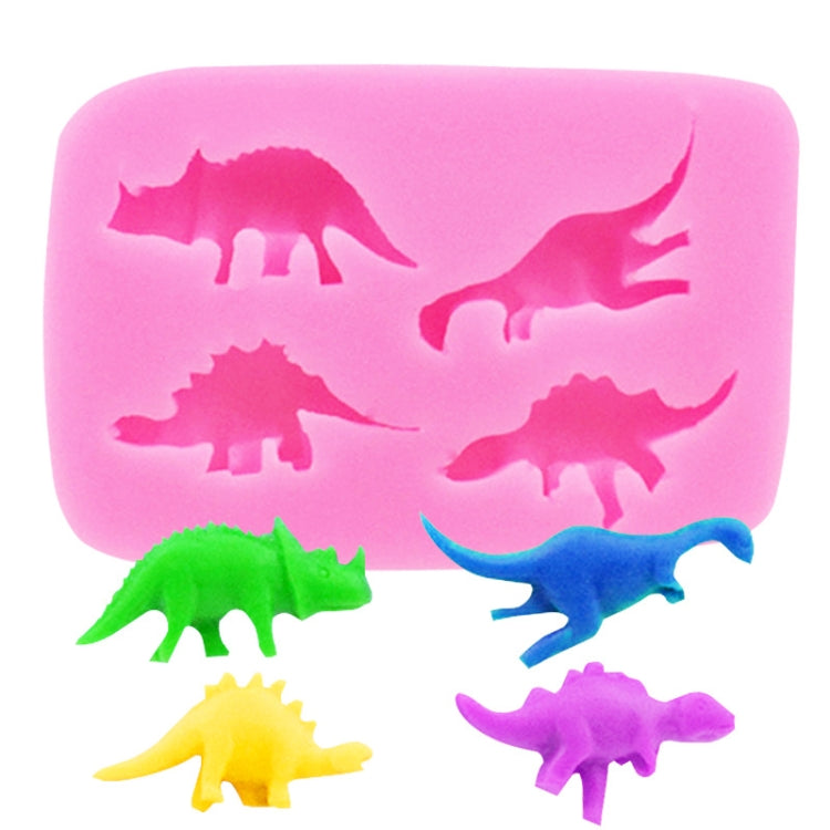 Pink dinosaur silicone mold with four dinosaur silhouettes in green, yellow, blue, purple