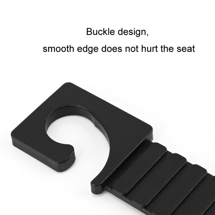 Black buckle accessory with U-shaped slot and ridged strap for car attachment