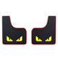 Pair of black car mud flaps with red edge, ribbed texture, yellow cat-eye detail