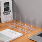 Clear acrylic desktop book rack with multiple bookends holding books on a desk