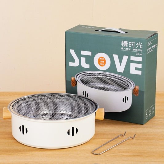 Round stainless steel charcoal grill with wire mesh basket and lid, compact outdoor cooker