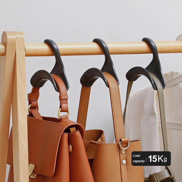 Gray arched hanger hooks on a wooden bar holding handbags, anti-deformation design