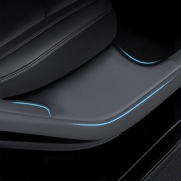 Black door sill protective pad installed along the rear door threshold