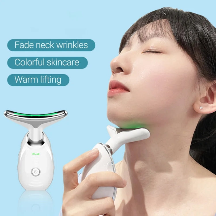 Handheld oval neck massager with green light strip used on neck area