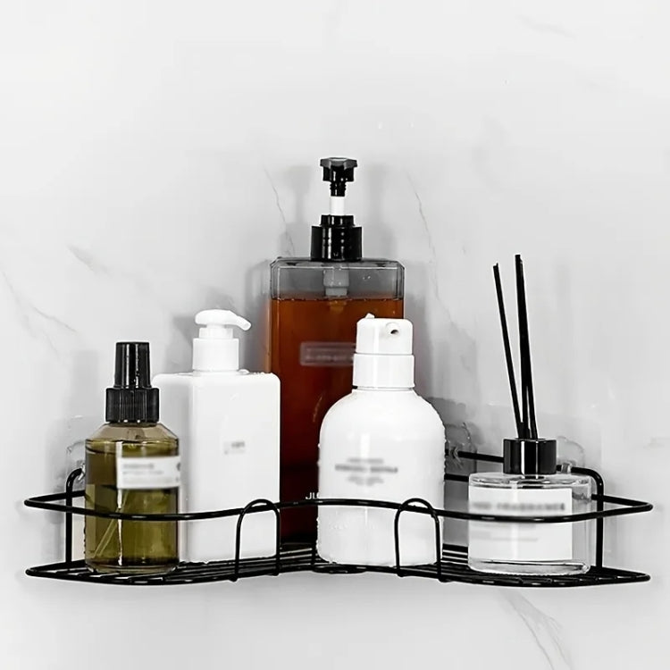 Black triangle corner bathroom storage rack with bottles, pump, and diffuser canisters