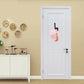 Self-adhesive hat rack wall hook holding a baseball cap