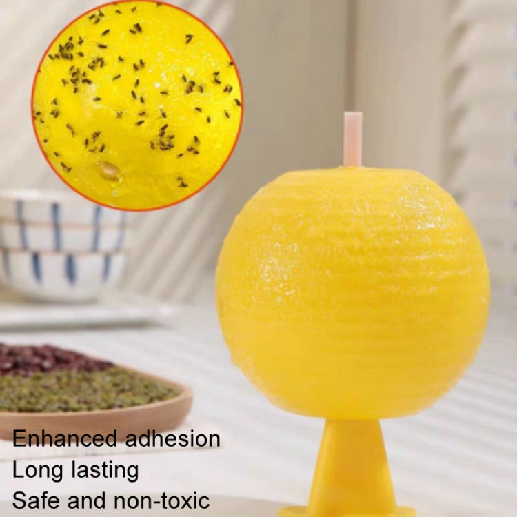 Yellow sticky insect trap ball with inset showing trapped insects