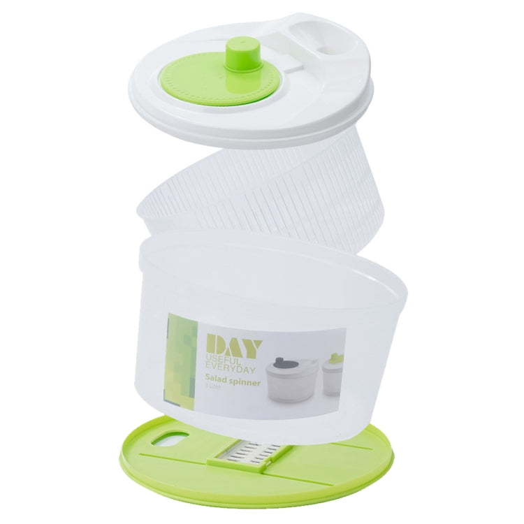 Vegetable dehydrator container with green top and base lid, mesh basket design