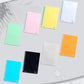 Assorted color non-slip writing pads in multiple shades, various sizes shown