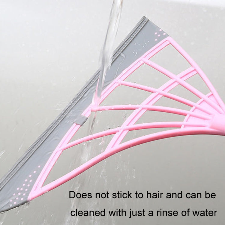 Hair cleaning broom with pink mesh head and gray base, rinsing-friendly design