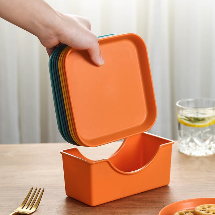 Plastic plate organizer base, orange, holding stacked plates