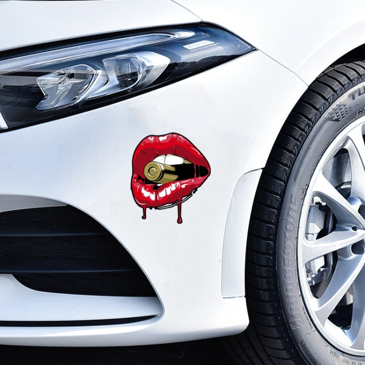 Red lip sticker with gold bullet on car fender
