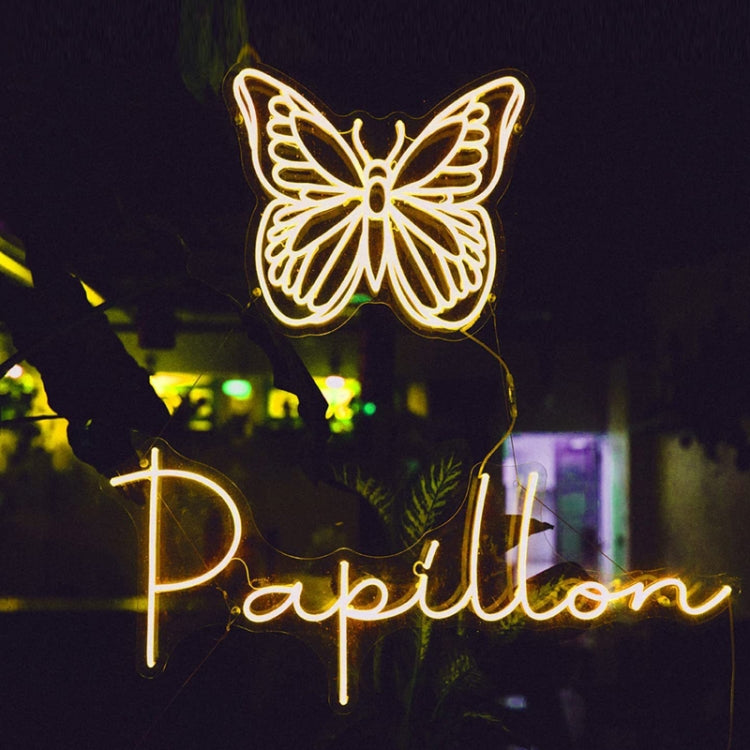 Glowing butterfly wall decoration made with flexible LED neon light strip.
