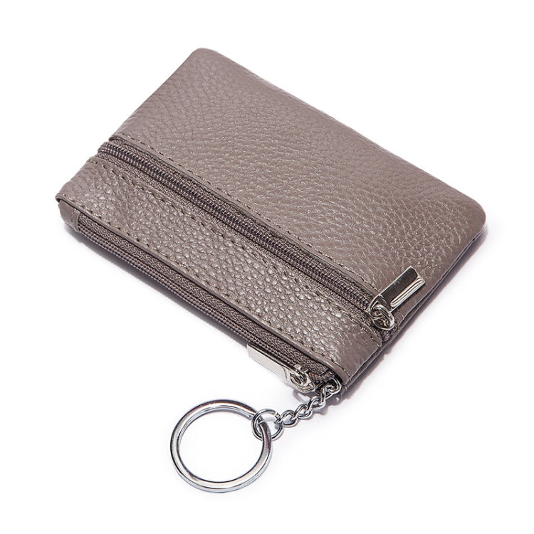 Gray leather mini wallet with two zip compartments and keychain ring.