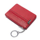 Red leather mini wallet with two zip compartments and keychain ring.