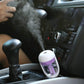 Violet car humidifier spray nozzle releasing mist inside the vehicle