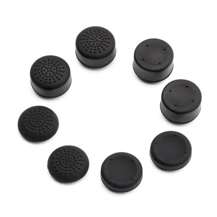 Assorted black silicone joystick caps with dotted texture and flat button tops