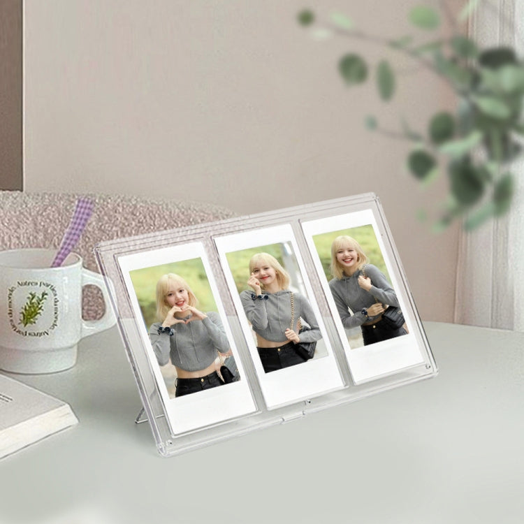 Clear three-slot vertical photo frame holding three square pictures