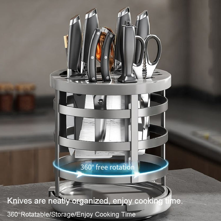 Rotary stainless knife storage cylinder with round base and slots for multiple knives