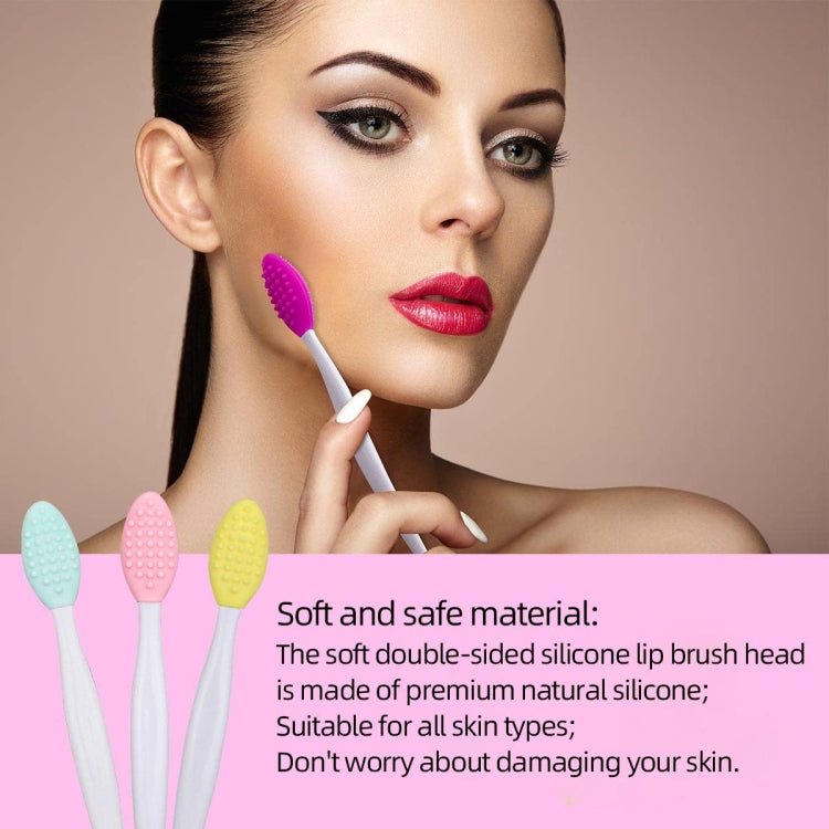 Purple silicone-tipped facial cleaning brush held near lips on a white handle