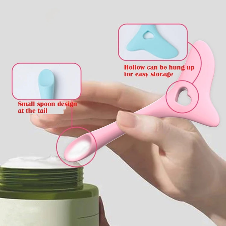 Pink silicone makeup spoon tool with heart hole and hollow hanger loop for storage