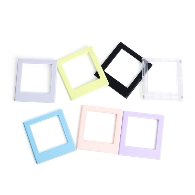 Set of square magnetic photo frame blocks in light blue, pink, black, and white
