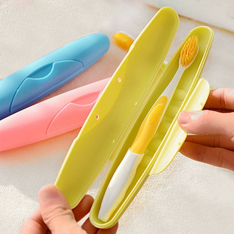 Travel toothbrush cases with lid, yellow and pink, with toothbrushes inside