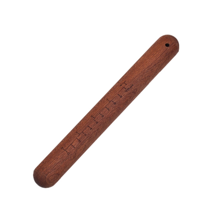 Dark red wooden rolling pin with handle end and small hanging hole