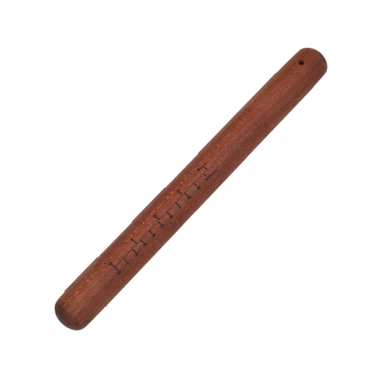 Dark red wooden rolling pin with engraved measurement scale along the stick