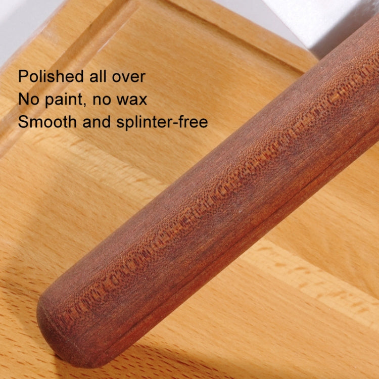 Red wooden rolling pin with polished surface and rounded end, splinter-free
