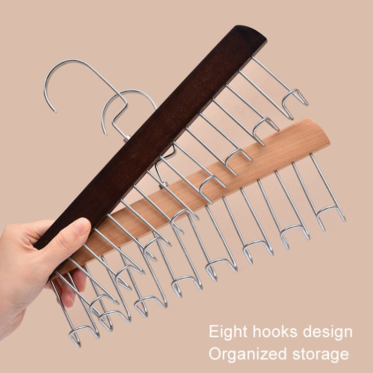 Wooden hanger rack with chrome wave hooks, held by a hand