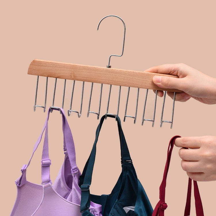 Hanging lingerie organizer rack with wave hooks and multiple garments on hooks