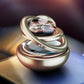 Car aromatherapy rotating solar ornament with clear globe, bronze-gold base, and silver trim