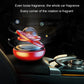 Red rotating solar car aromatherapy ornament on car seat with clear spinning globe