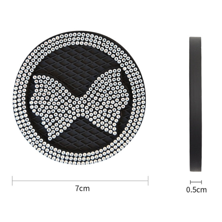 Car anti-slip coaster with diamond-bow crystal design, white rhinestones on black mat