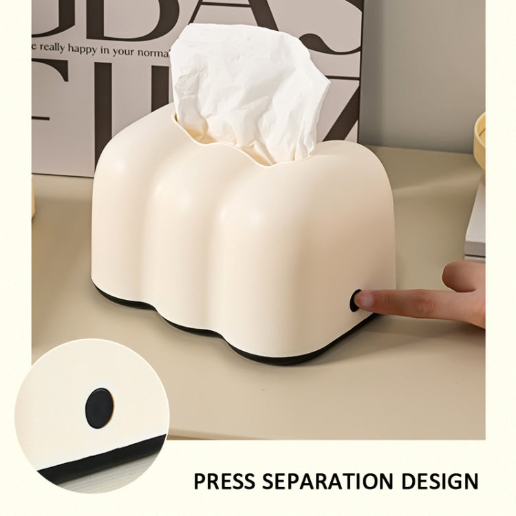 Cream cloud tissue holder dispensing tissue; press-separation design shown in use
