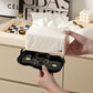 Cream cloud napkin holder with tissue pulled out; black base tray visible