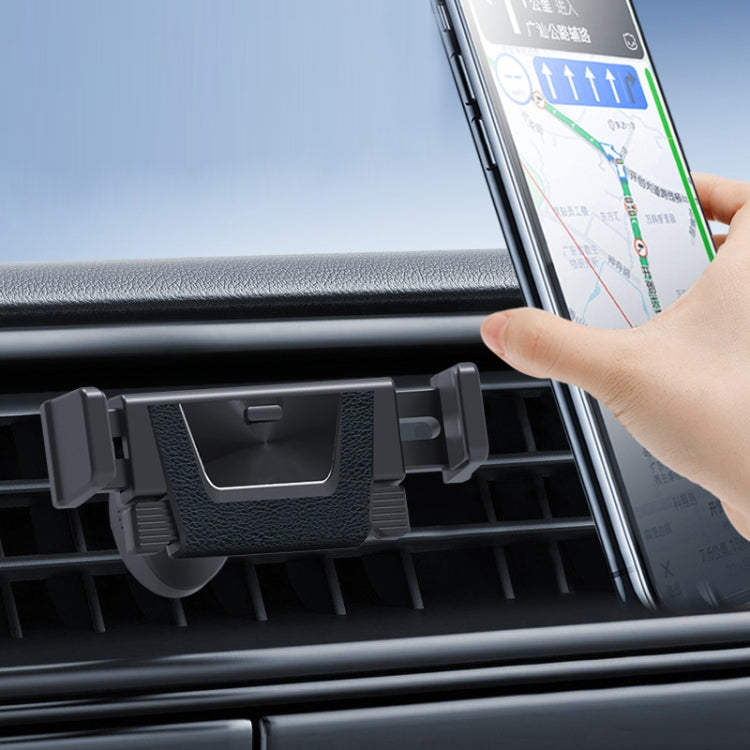 Black car air vent phone holder bracket with hand placing a smartphone