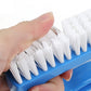 Handheld blue brush with white bristles on the edge for detailed seam cleaning