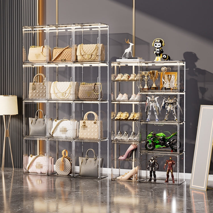 Set of clear stackable storage boxes in a cabinet, displaying bags and accessories