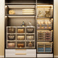 Transparent stackable storage boxes in a cabinet, organizing handbags and small items