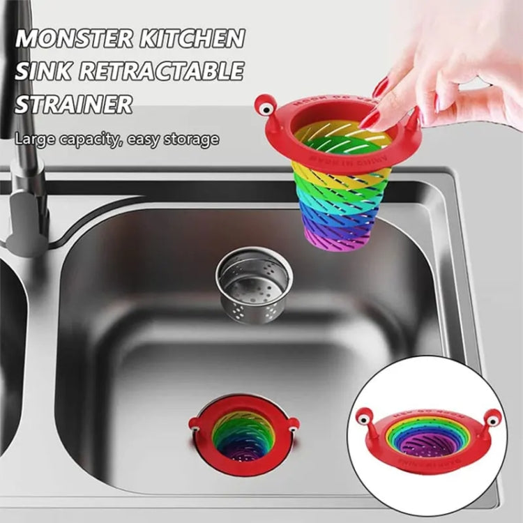 Retractable rainbow monster sink strainer in red with folded multicolor accordion mesh
