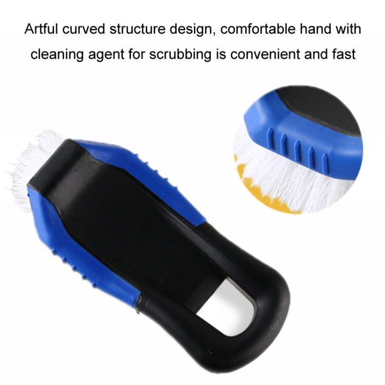 Curved car cleaning brush with stiff white bristles and dark blue, black handle