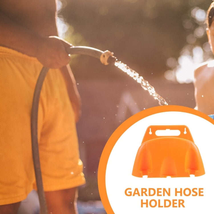 Orange plastic wall-mounted hose holder with front cradle and top slot for mounting