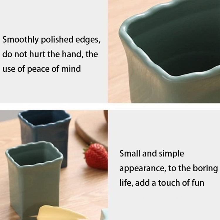 Dark green vegetable slicing cup tool with smooth scalloped rim