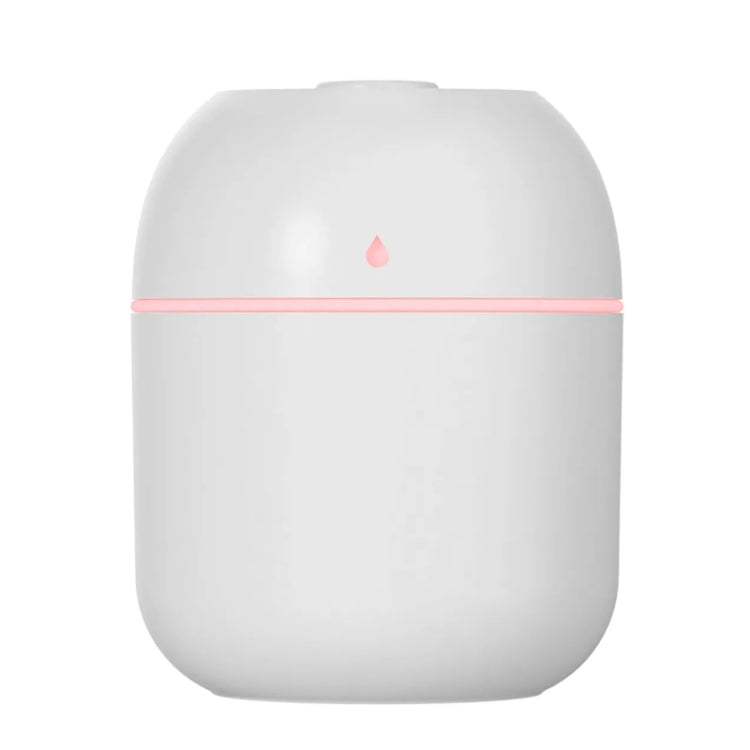 White compact USB humidifier with pink accent band and mist outlet on top