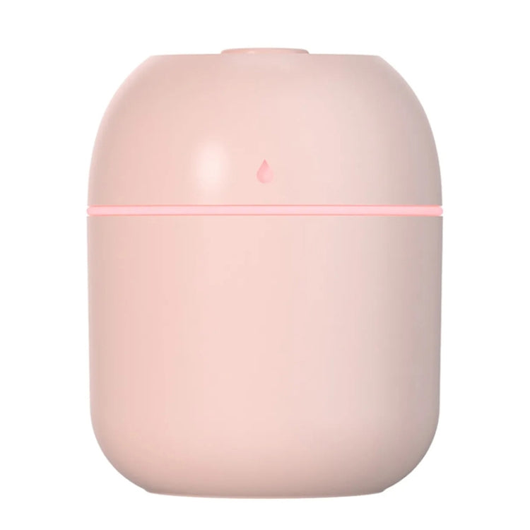 Pink compact USB humidifier with pink accent band and mist outlet on top